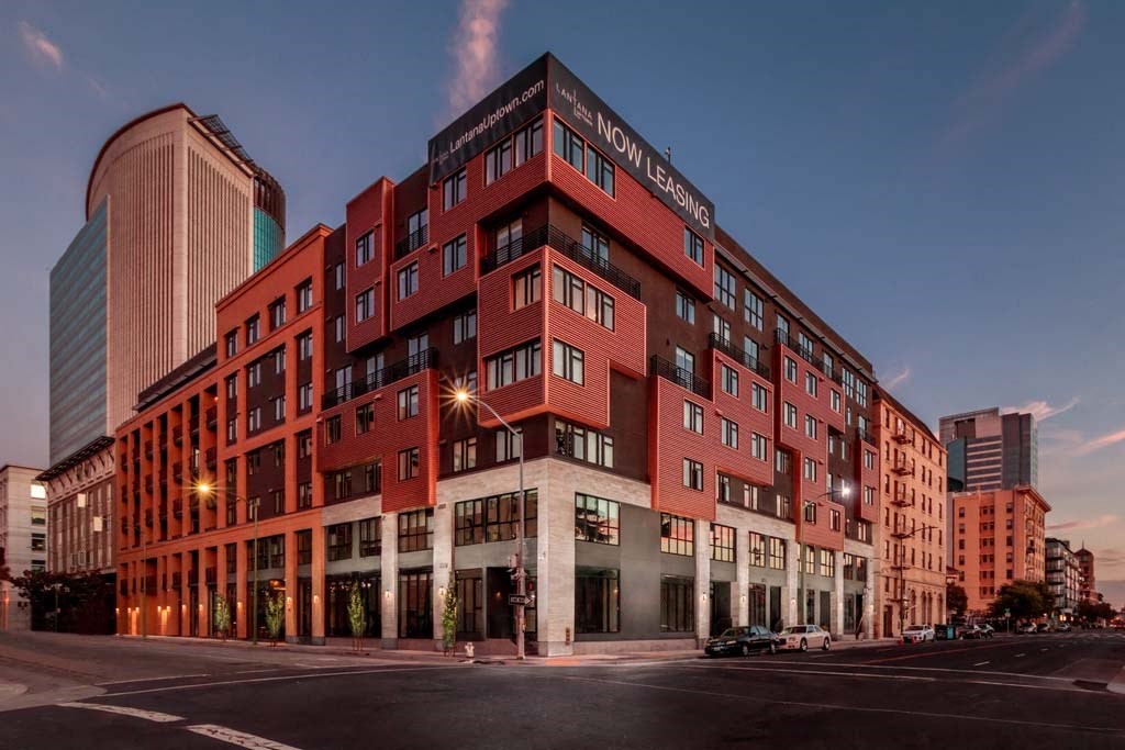 a large red building on the corner of a city street