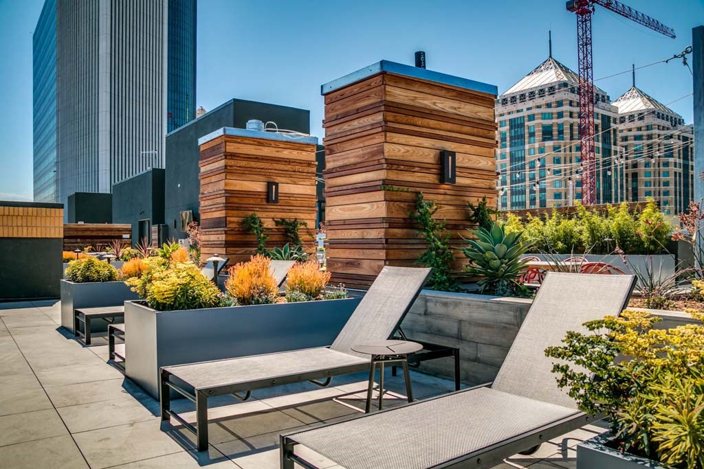 a terrace with chairs and tables on a roof top