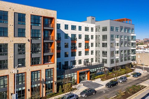 an aerial view of an apartment building on a city street