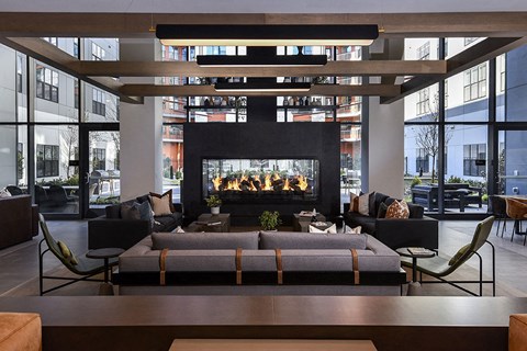 a living room with a couch and a fireplace