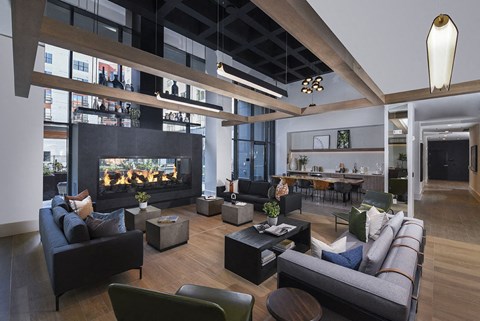 a large living room with couches and a fireplace