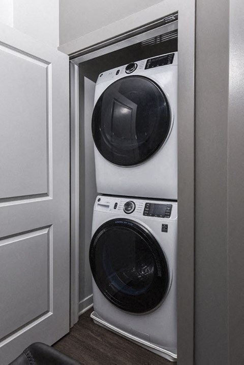 a washing machine and dryer in a small closet