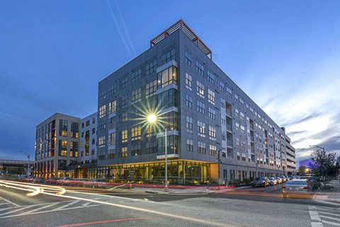 a rendering of a building on a city street