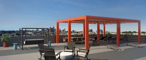 a rooftop terrace with orange columns and chairs and a view of the city