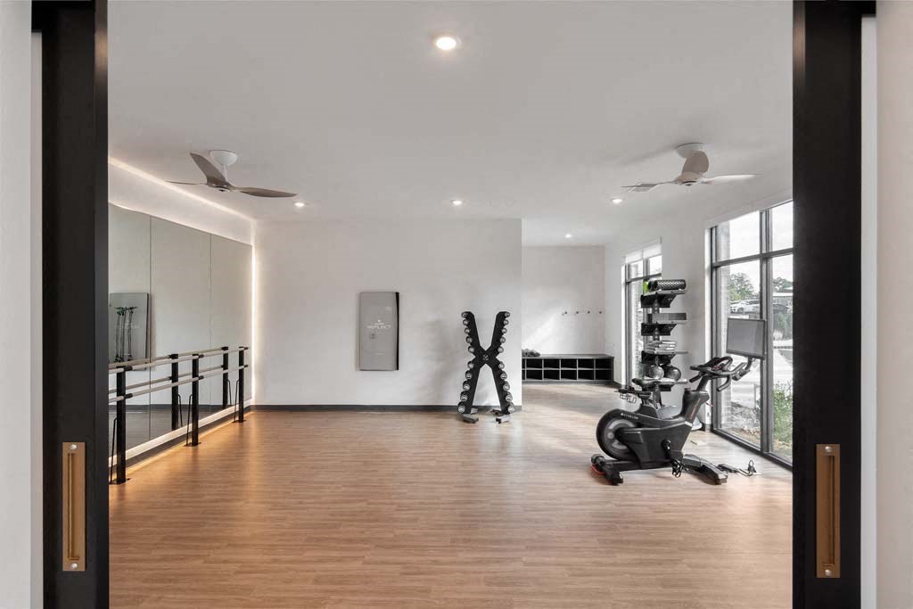 the home gym has plenty of space and a large window