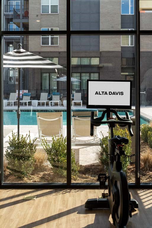 a swimming pool is seen through a window of a building