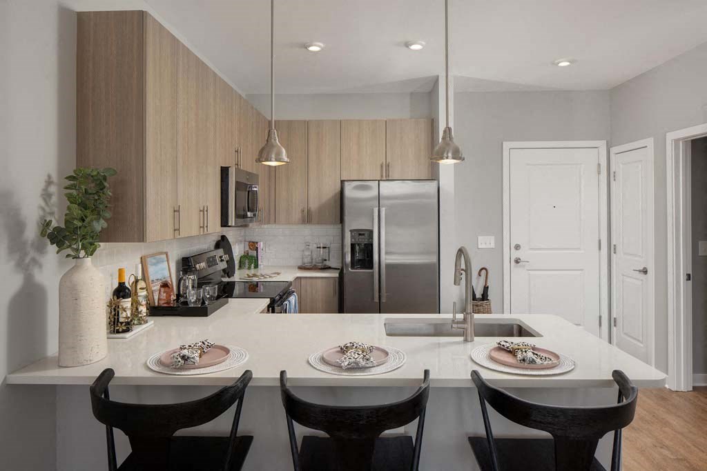 a kitchen with a white counter top