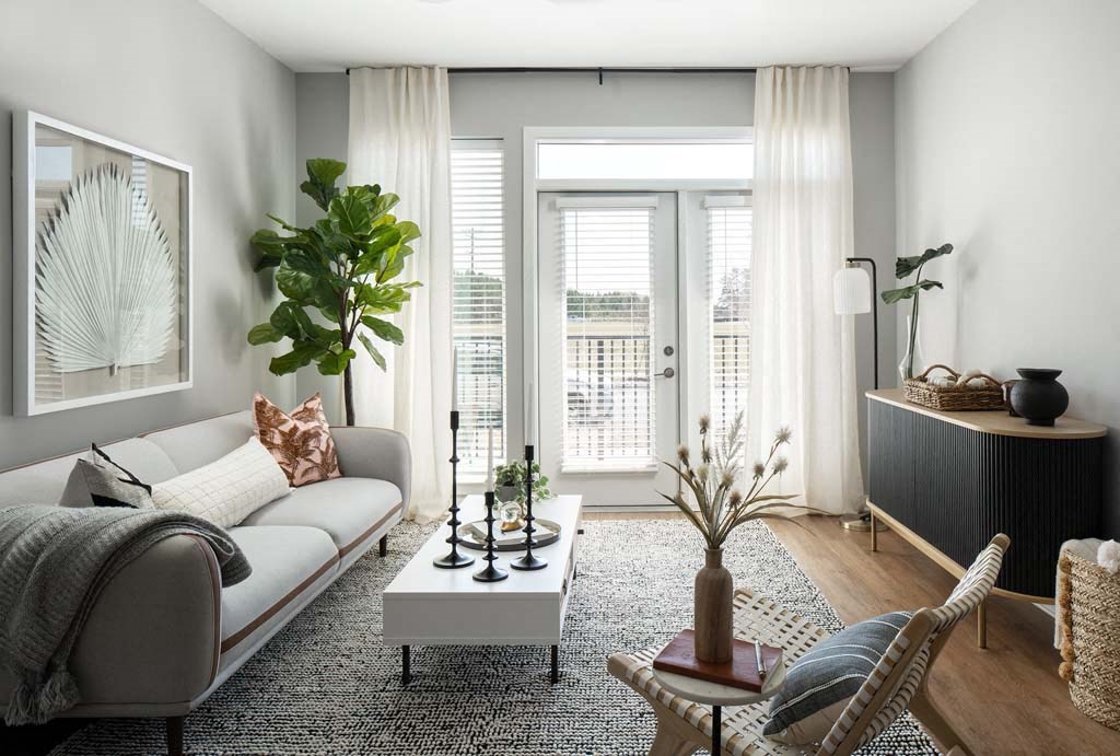 a living room with a white couch and a table