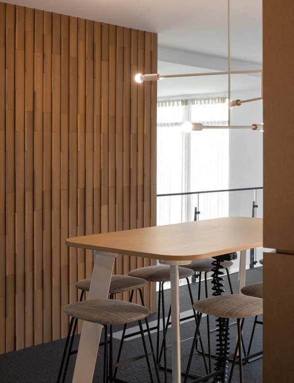 a dining room with a wooden table and chairs