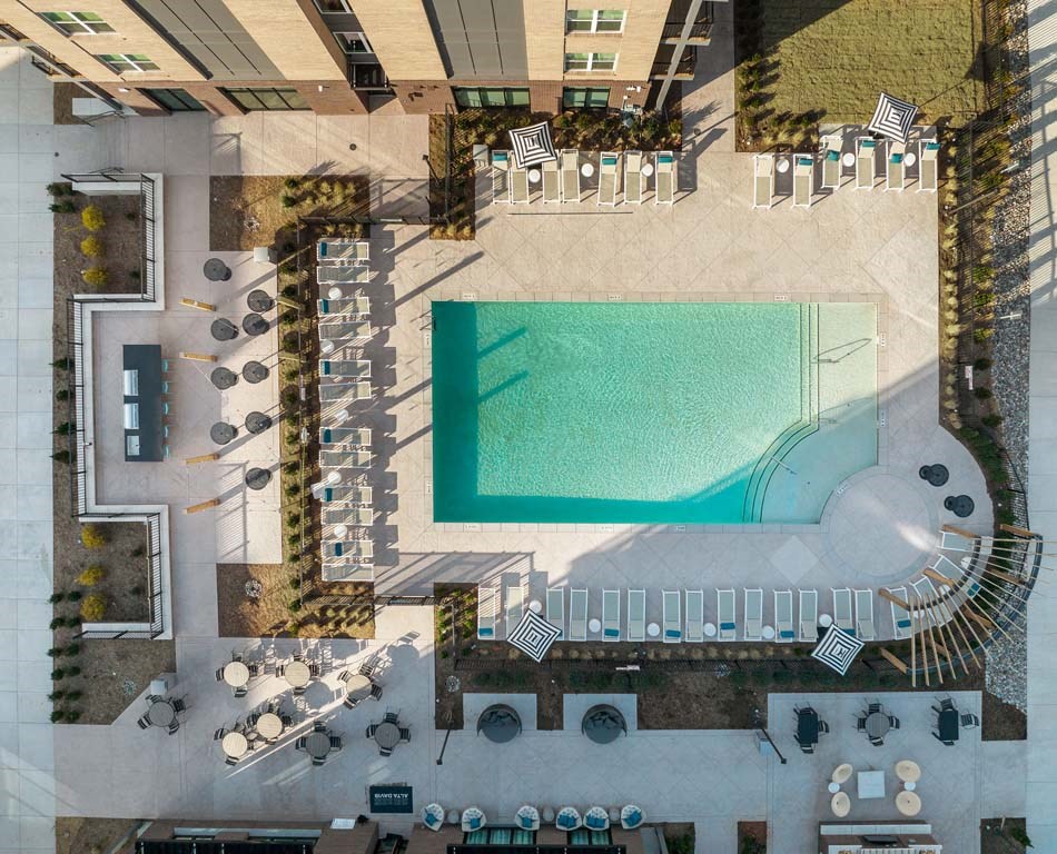 a rendering of the pool area of a hotel with a swimming pool