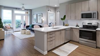 a kitchen and living room in an apartment