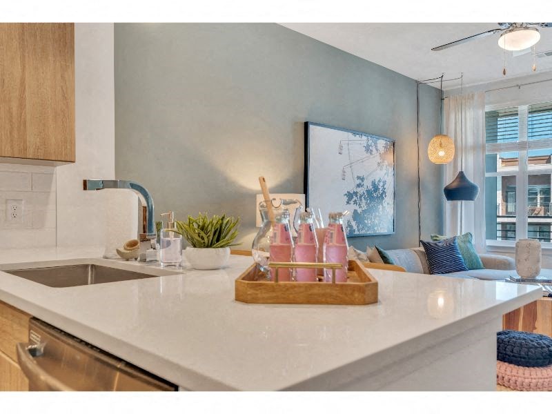 a kitchen with a counter top and a sink