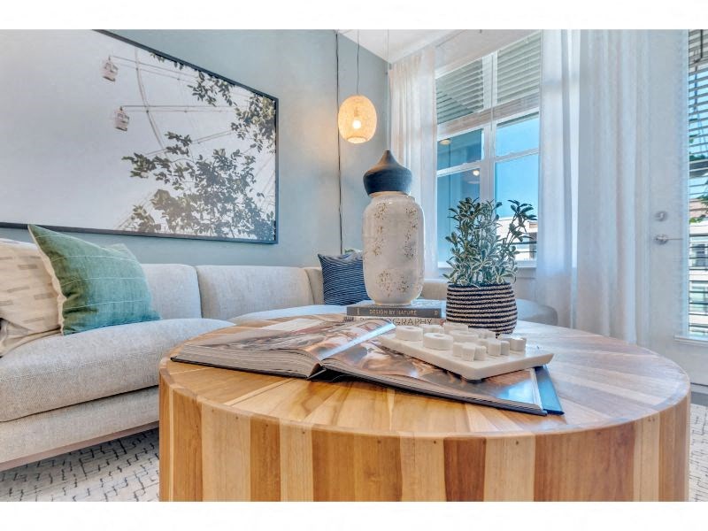 a living room with a table and a couch