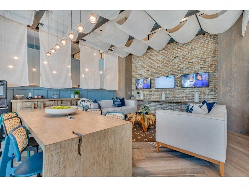 a living room with a table and a couch and a tv