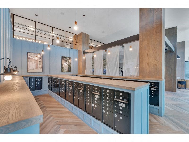 a tasting room with blue walls and a long counter with wine racks