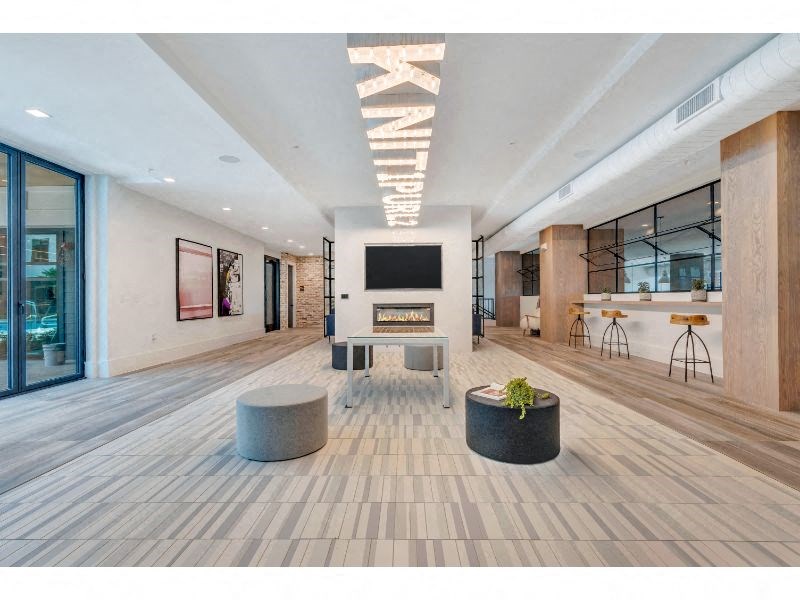 a large room with a fireplace and a television in the middle