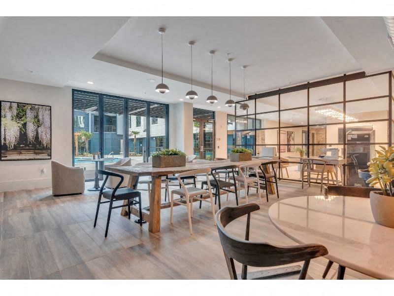 a large dining room with a large table and chairs