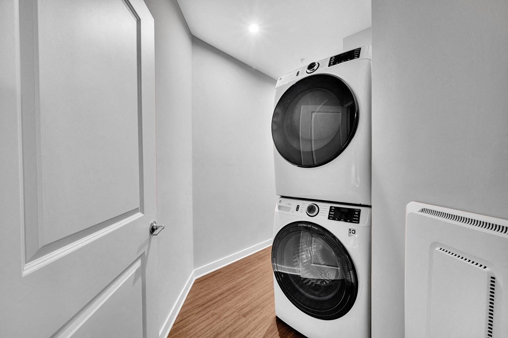 a front loading washer and dryer in a laundry room