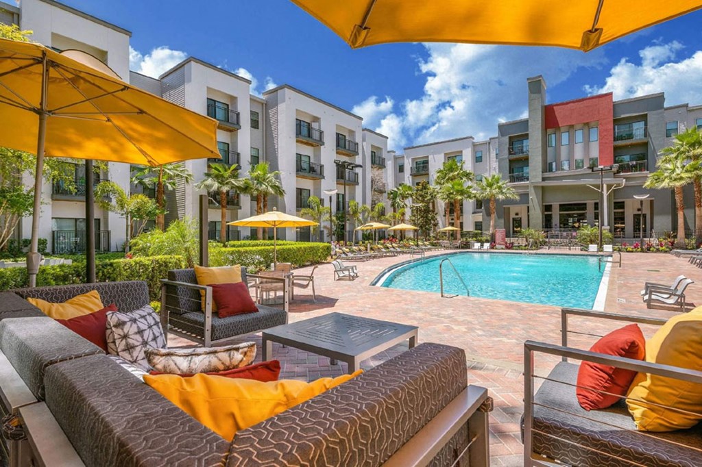our apartments offer a pool and lounge area with umbrellas