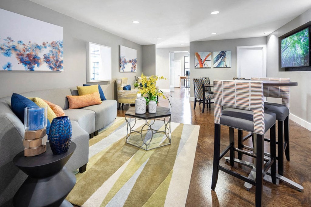 a living room with a couch and a dining room table