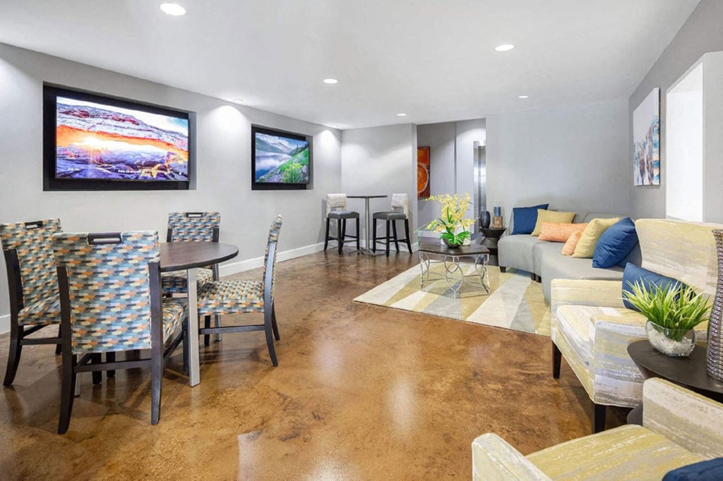 a living room with a table and chairs and a couch