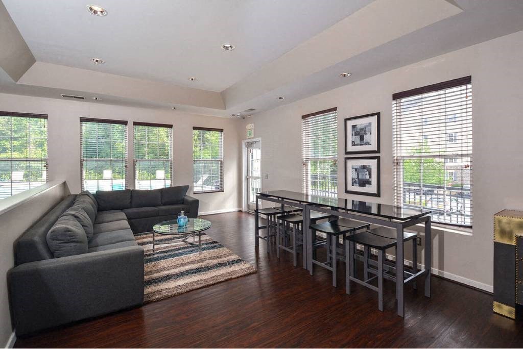 a living room with a couch and a dining table
