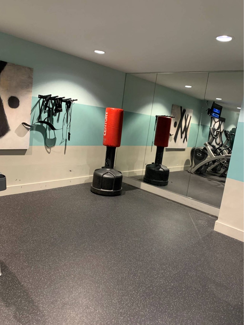 a bowling alley in a museum with bowling pins on the walls