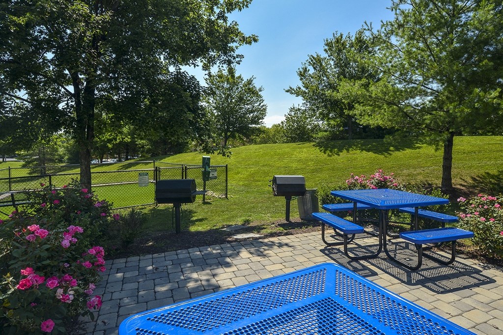 a patio with a picnic table and ping pong table