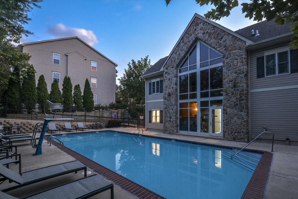 a swimming pool in the backyard of a house