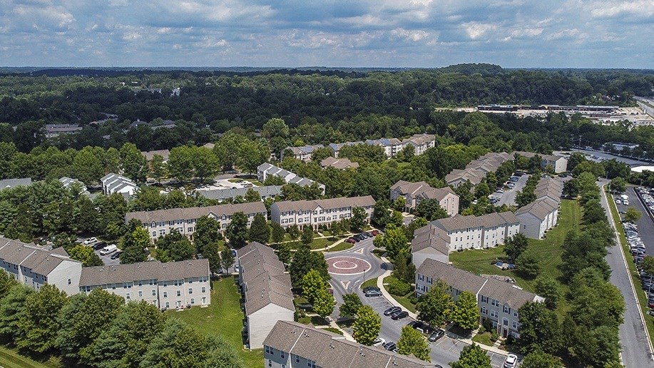 an aerial view of a city with buildings and trees