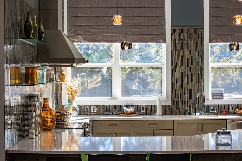 a kitchen with a large window and a counter top