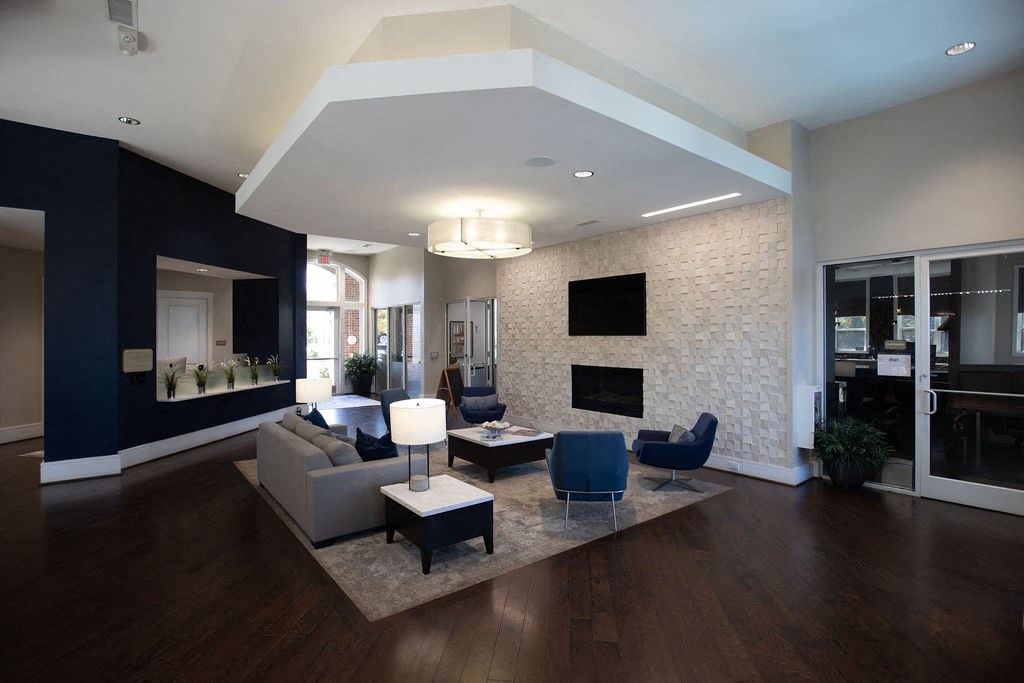 a living room filled with furniture and a fireplace
