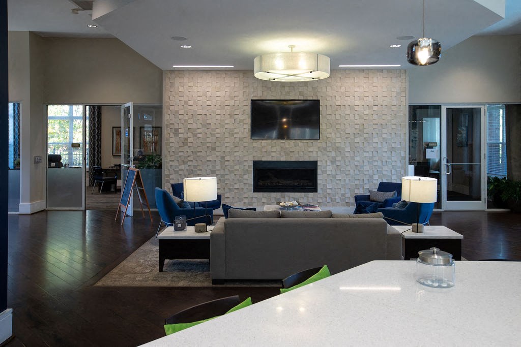 a large living room with a couch and a television