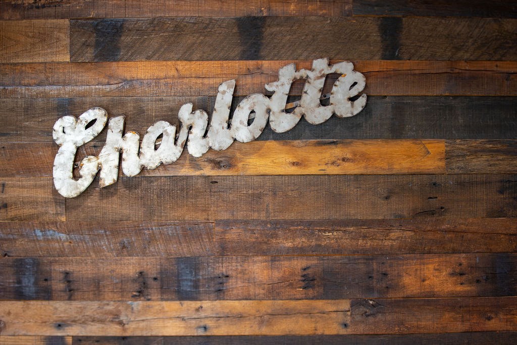 a sign that reads chocolate on a wooden table