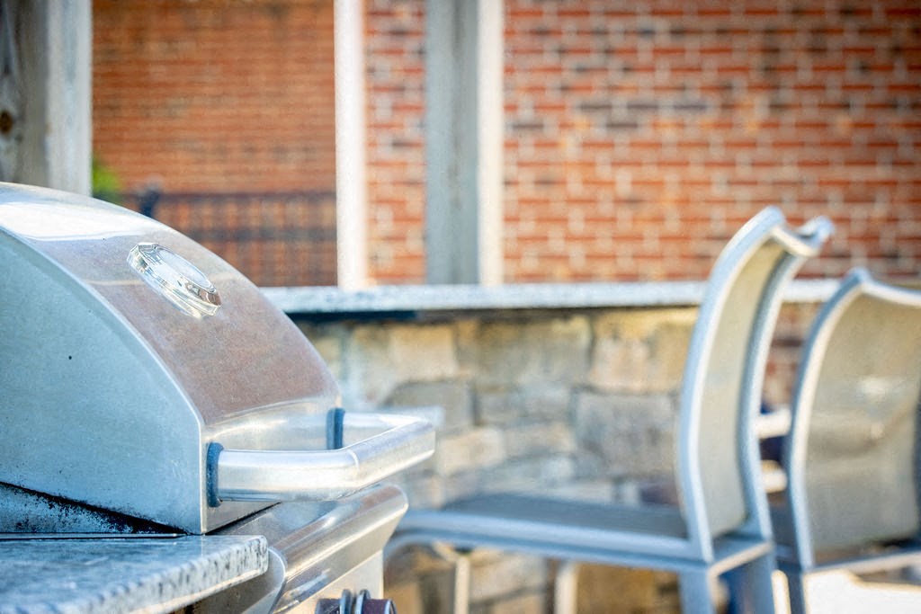 a group of chairs sitting next to a parking meter