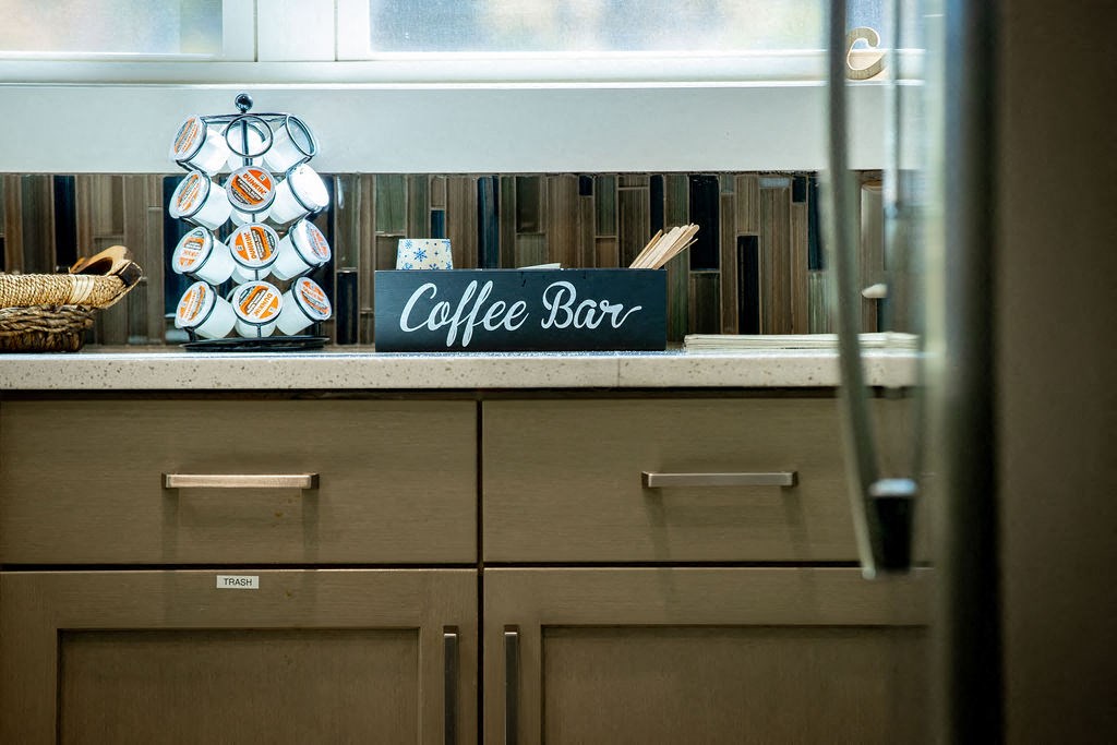 a coffee bar sign on a counter in a kitchen