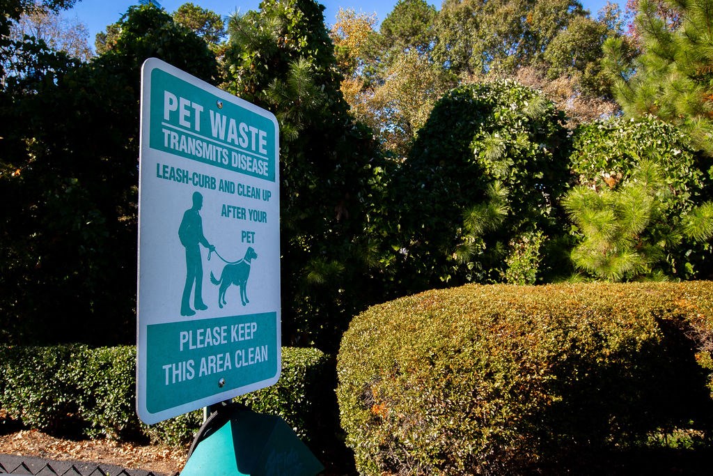 a sign that reads pet waste transforms dogs please keep this area clean