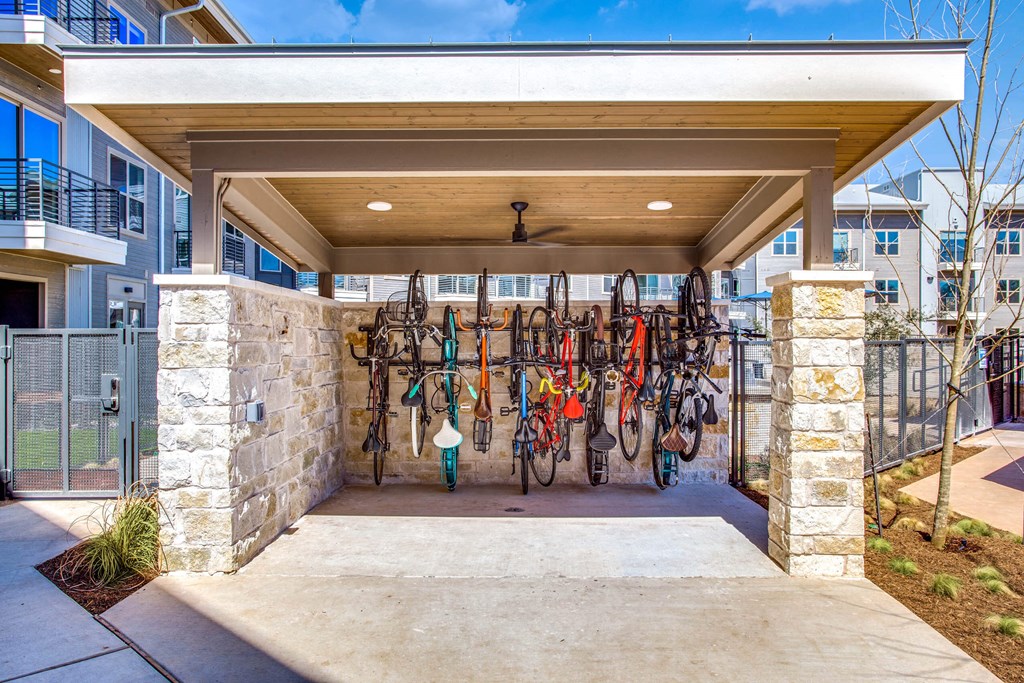 the front entrance of a building with a rack of skis on the wall