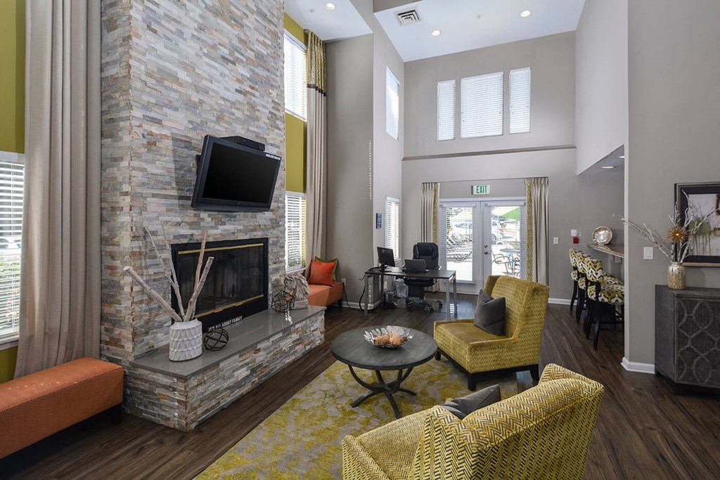 a living room with a fireplace and a television