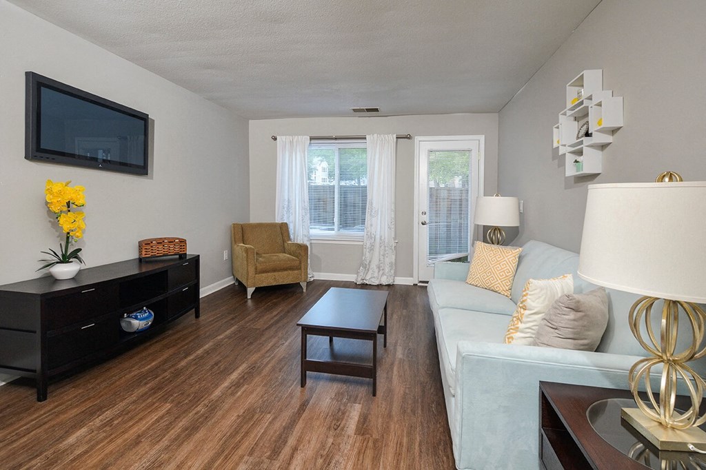 a living room with a couch and a tv