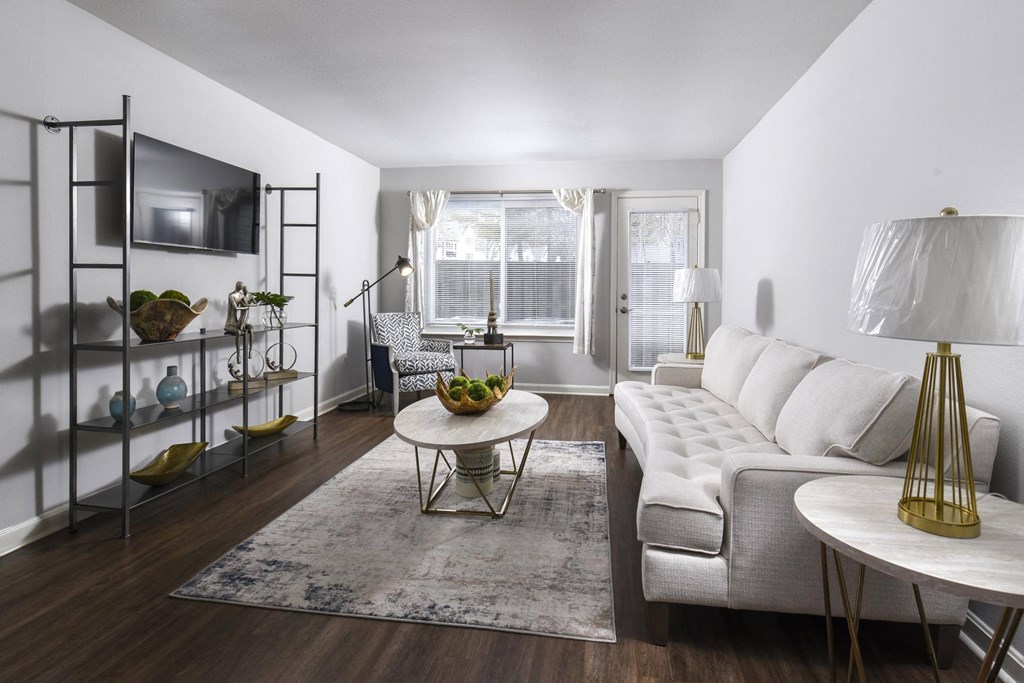a living room with a white couch and a table