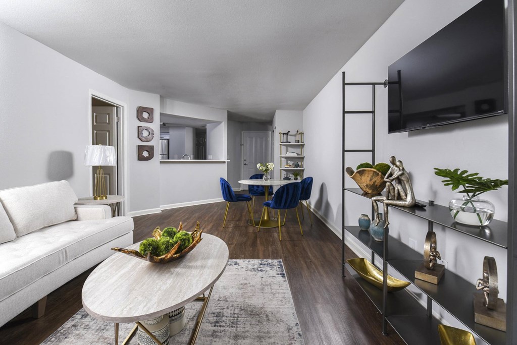 a living room with a couch and a table and a television