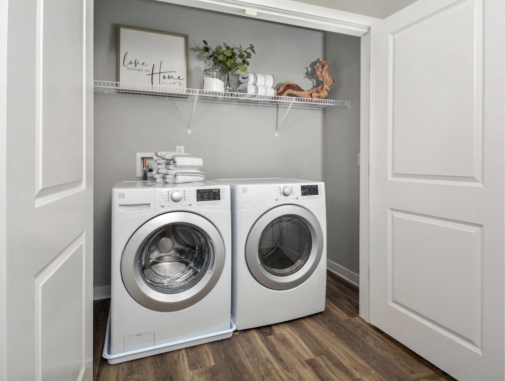 a small laundry room with a washing machine and a dryer