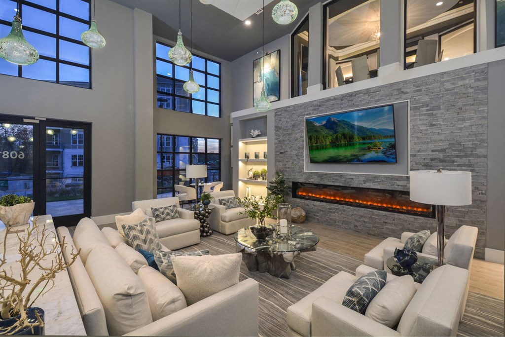 a living room with couches and a fireplace and a television