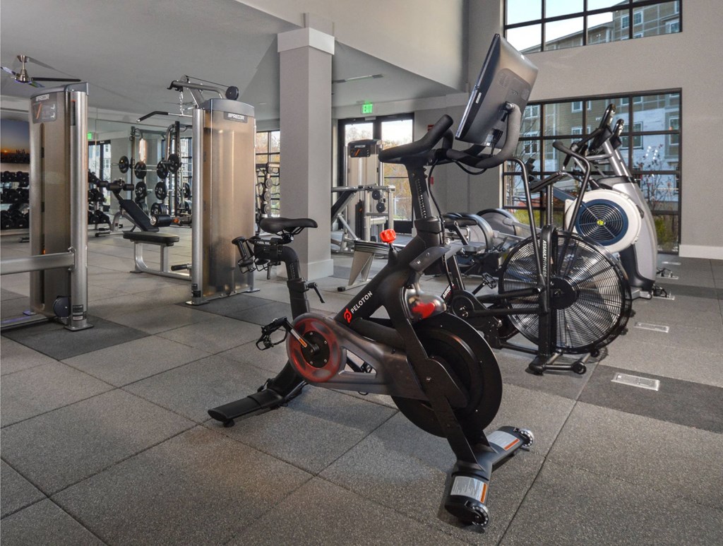 a stationary bike in a gym with bikes in the background