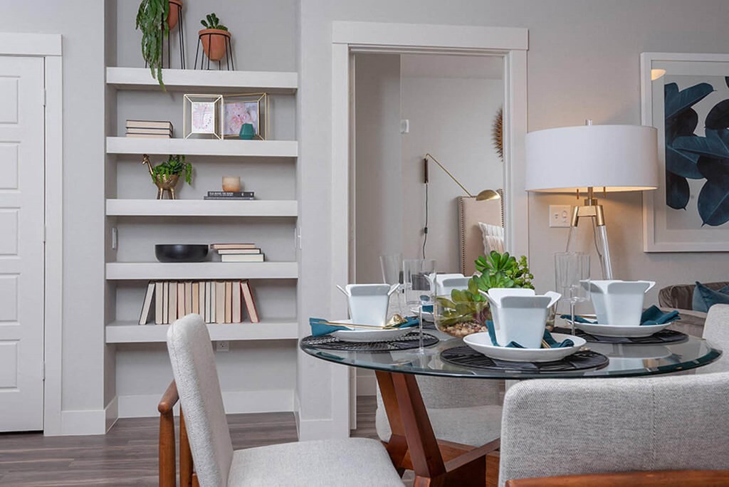 a dining room with a table and chairs