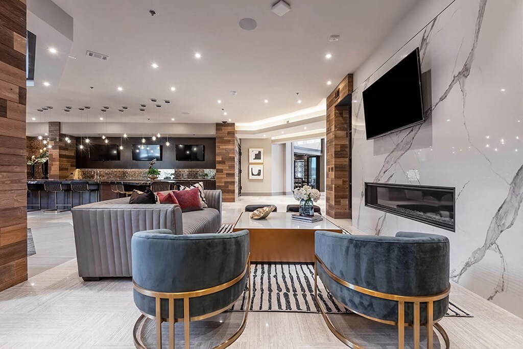 a living room with a fireplace and a television