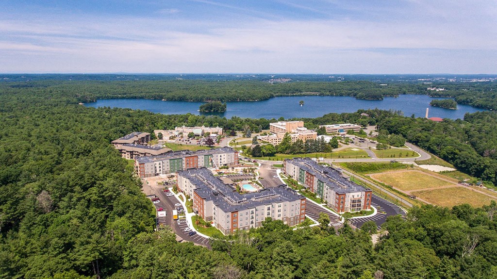 an aerial view of an apartment complex near a lake