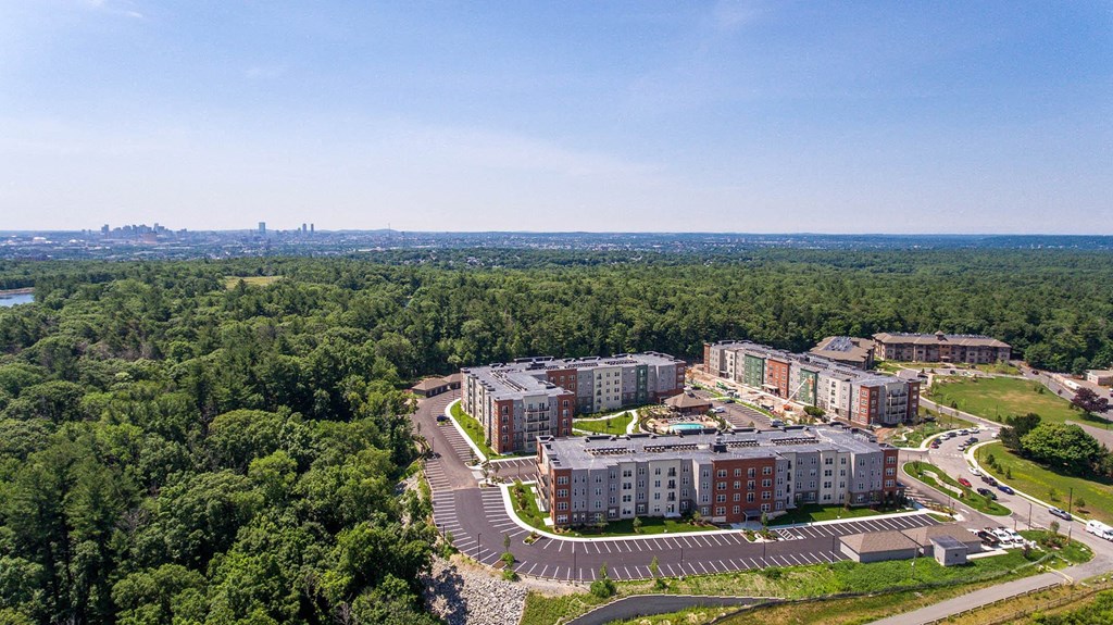 an aerial view of a campus with trees and buildings