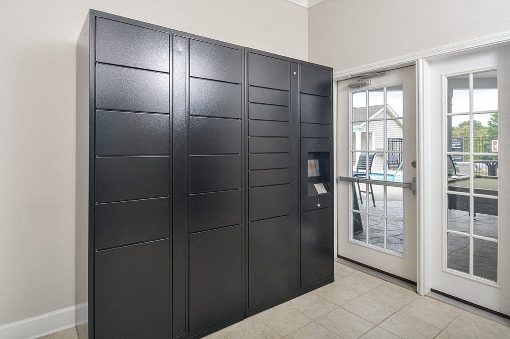 a room with a closet and a door to a patio
